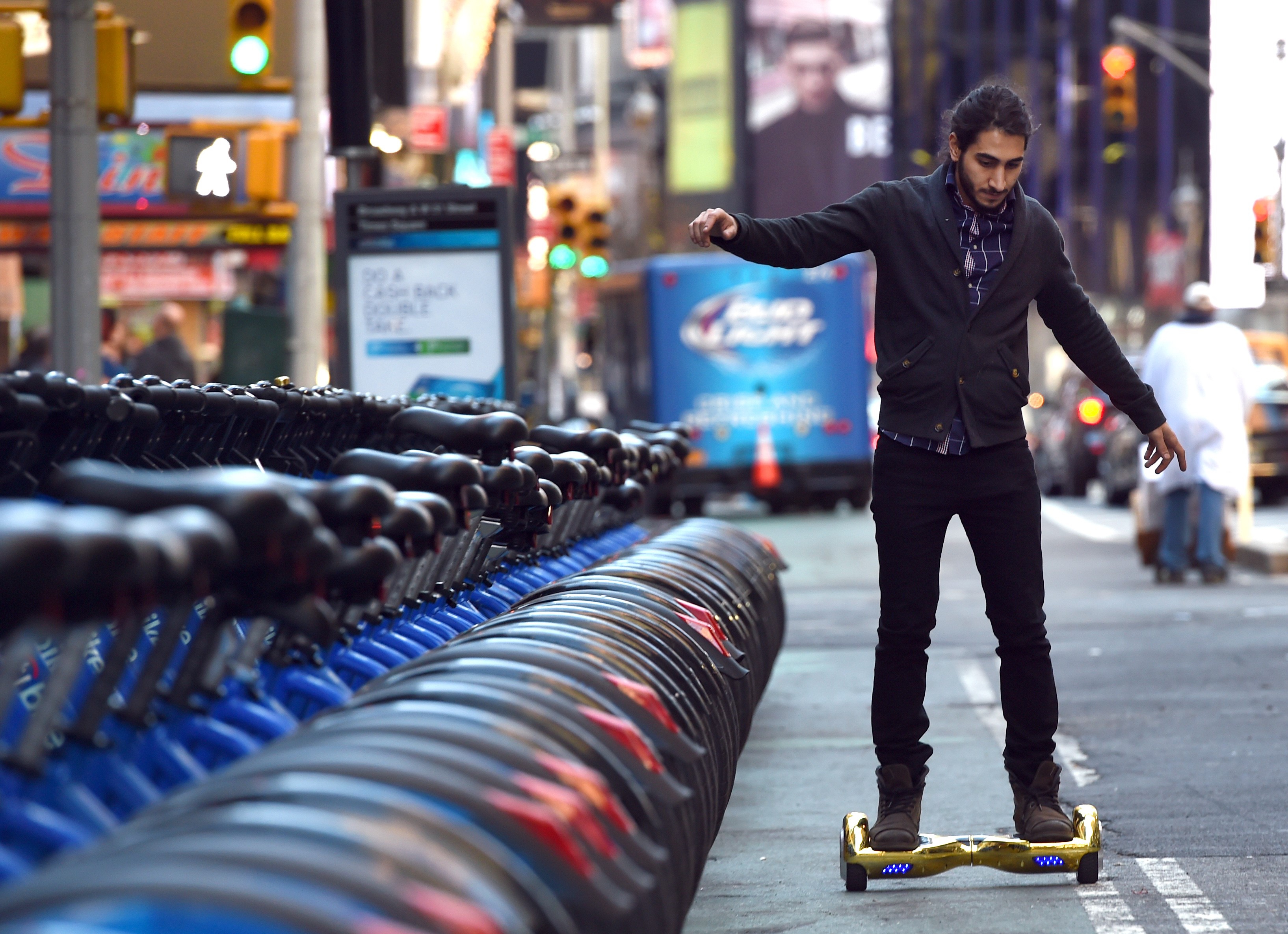 Whizboard Store manager 'Mor Loud' demonstrates the Hoverboard on Broadway in Times Square  December 15, 2015. (Photo: TIMOTHY A. CLARY/AFP/Getty Images)