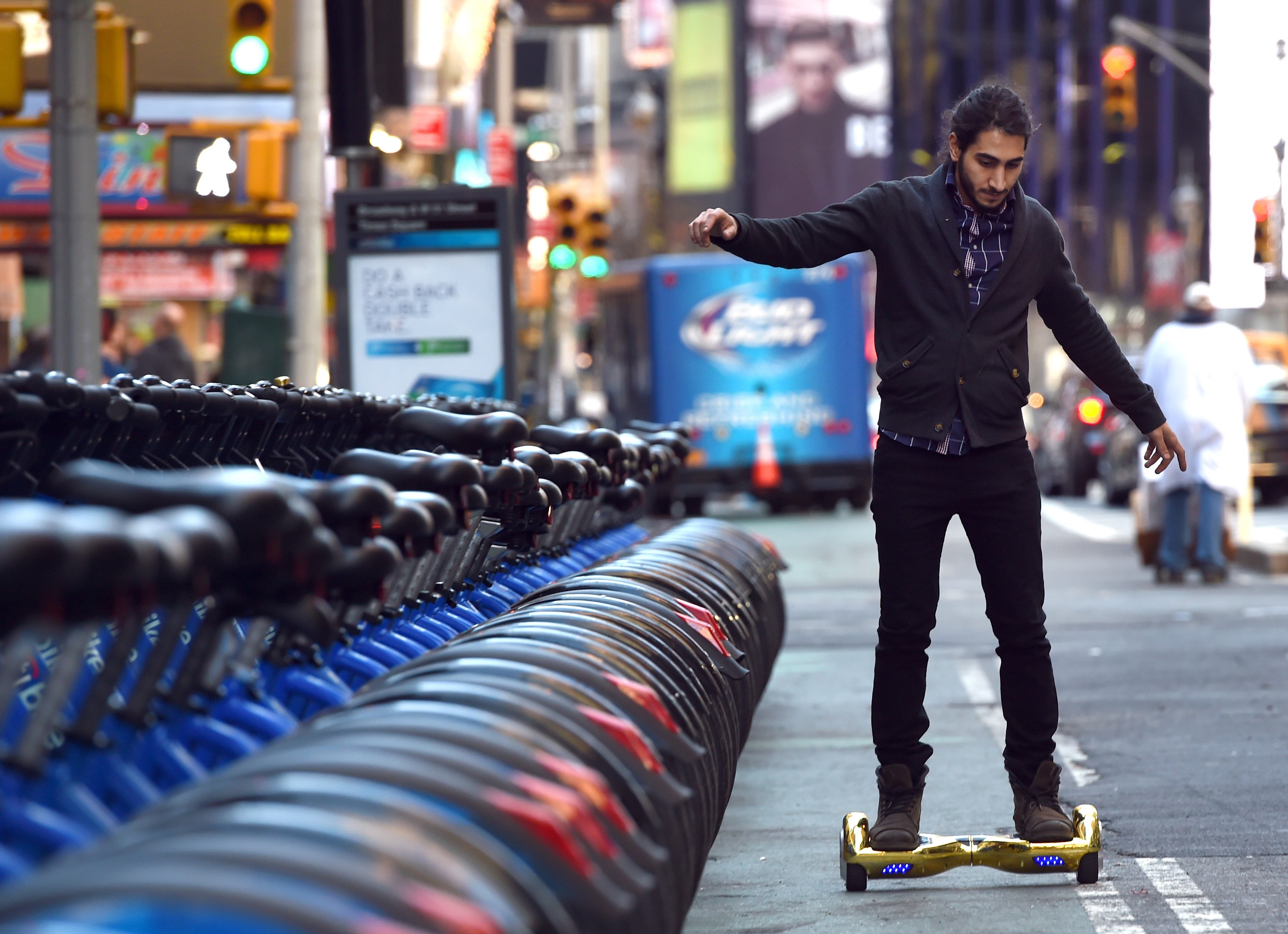 Whizboard Store manager 'Mor Loud' demonstrates the Hoverboard on Broadway in Times Square December 15, 2015. (Photo: TIMOTHY A. CLARY/AFP/Getty Images)