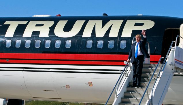 MESA, AZ - DECEMBER 16: Republican presidential candidate Donald Trump waves to the crowd as he arrives at a campaign event at the International Air Response facility on December 16, 2015 in Mesa, Arizona. Trump is in Arizona the day after the Republican Presidential Debate hosted by CNN in Las Vegas, Nevada. (Photo by Ralph Freso/Getty Images)