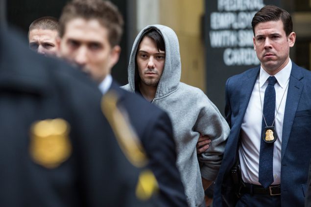 Martin Shkreli, CEO of Turing Pharmaceutical, is brought out of 26 Federal Plaza by law enforcement officials after being arrested for securities fraud last month (Photo: Andrew Burton for Getty Images)