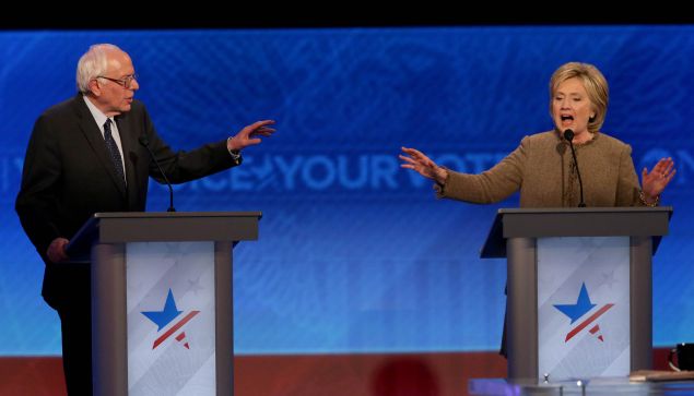 Bernie Sanders and Hillary Clinton debate at Saint Anselm College December 19, 2015 in Manchester, New Hampshire. (Photo by Andrew Burton/Getty Images)