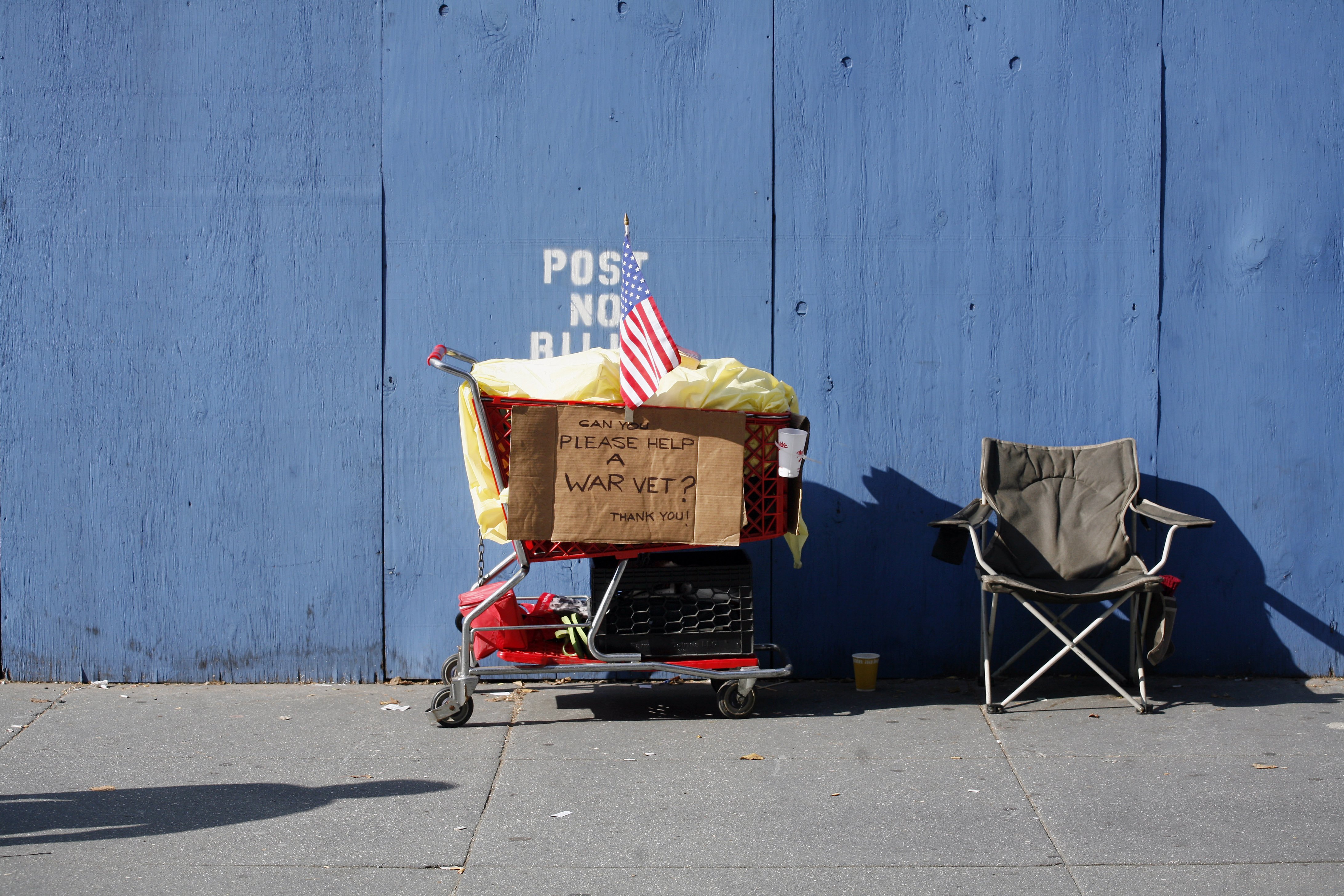 A homeless person's grocery cart and chair is shown along Fifth Avenue during the annual Veterans Day in 2006. (Photo by Michael Nagle/Getty Images)