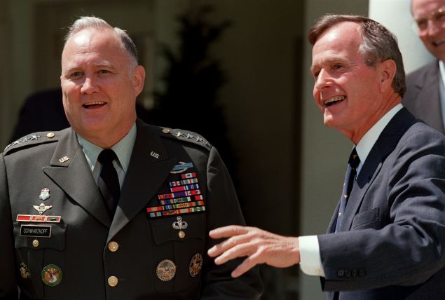 Gulf War commander, US four star general Norman Schwarzkopf (L), who commanded the international coalition which ousted Iraqi forces from Kuwait during Operation Desert Storm, and US President George Bush face media 23 April 1991 in the White House, Washington, D.C., before a private luncheon. (Photo credit should read J. DAVID AKE/AFP/Getty Images)