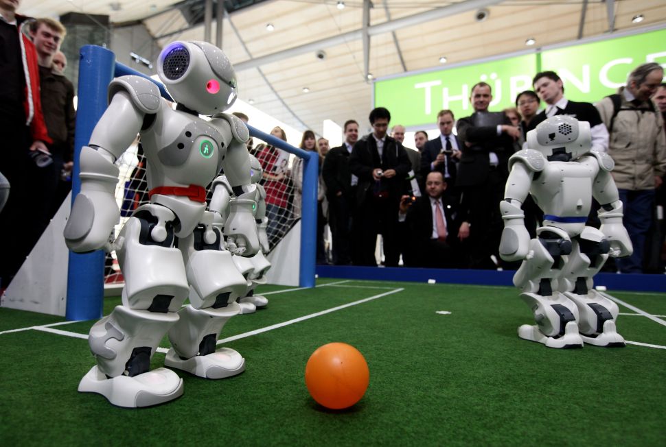 Robots play football in a demonstration of artificial intelligence. (Photo: Sean Gallup/Getty Images)