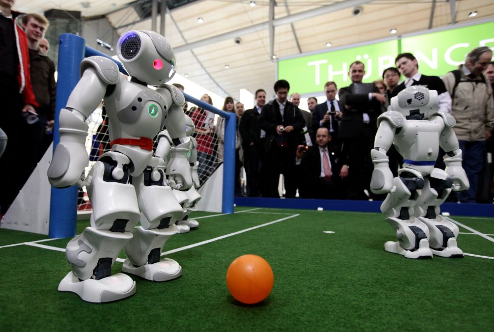 Robots play football in a demonstration of artificial intelligence. (Photo: Sean Gallup/Getty Images)
