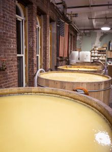 Moonshine or bourbon in the beer stage, interacting with yeast inside the Isseks Brothers custom wooden vats. (Photo: Kaitlyn Flannagan for Observer)