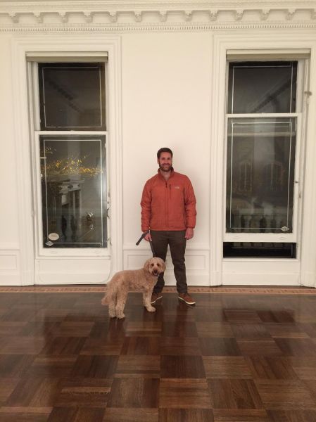 Harper Levine's brother and his "goldendoodle" in his new Upper East Side space. (Photo: Courtesy of Harper's Books)
