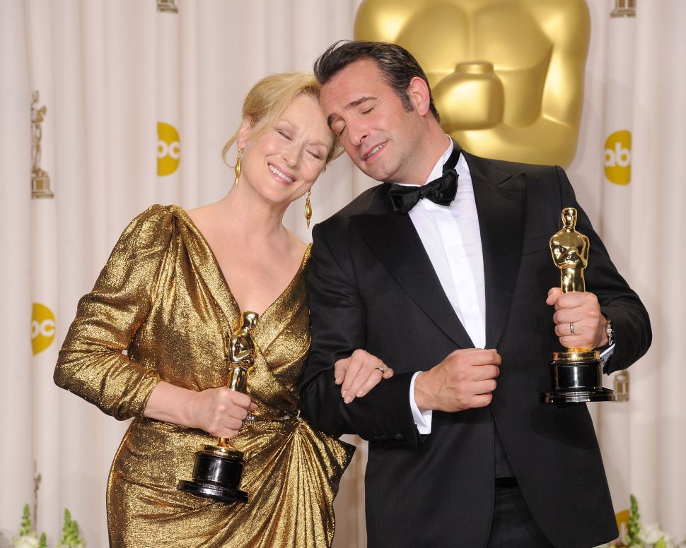 2012: Meryl Streep, Jean Dujardin pose in the press room at the 84th Annual Academy Awards with their awards for The Iron Lady and The Artist, respectively (Photo: Jeff Kravitz for FilmMagic)
