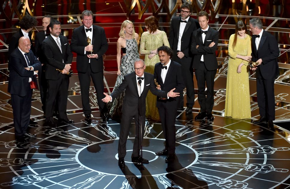 Michael Keaton, Alejandro Gonzalez Inarritu accept the Best Picture award for 'Birdman' onstage during the 87th Annual Academy Awards on February 22, 2015. (Photo by Kevin Winter for Getty Images).