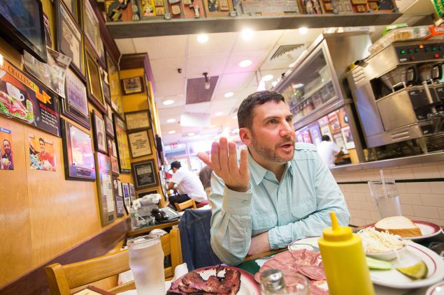 Author Ted Merwin kibitzes over platters of pastrami and beef tongue at Ben’s Best in Queens. (Photo: Michael Nagle for Observer)