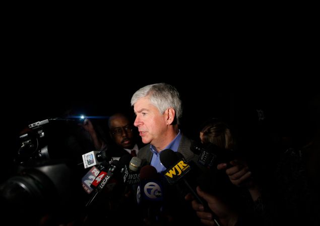 DETROIT, MI - MAY 21: Michigan Governor Rick Snyder speaks speaks to reporters after a luncheon May 21, 2014 in Detroit, Michigan. JP Morgan Chase CEO Jamie Dimon announced during the luncheon that JP Morgan Chase will invest $100-million to help the city of Detroit with blight removal, urban development, home loans and retraining people in the work force. (Photo by Joshua Lott/Getty Images)