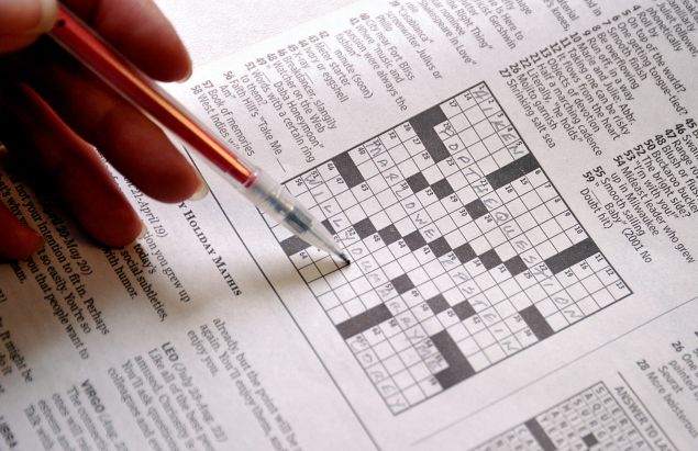 This April 18, 2011 photo shows the April 17 Sunday Washington Post crossword puzzle. The Washington Post crossword puzzle had special meaning this weekend for one local couple. With the complicity of the newspaper, Corey Newman, 28, of Alexandria, Virginia, proposed to his live-in girlfriend, Marlowe Epstein, 31, through clues buried in a specially-crafted puzzle.The clue for 37 Across, for example, asked for the name of a role in the movie "Shakespeare in Love." The answer -- Marlowe. 39 Across asked for the name of a "Casablanca" screenwriter. The answer -- Epstein. The clincher was 51 Across: "Words with a certain ring to them." As soon as Epstein came up with the answer -- "Will you marry me" -- Newman got down on one knee, whipped out a diamond ring and repeated the question, the Post reported. "Yes, of course!" Epstein said. AFP PHOTO/Karen BLEIER (Photo credit should read KAREN BLEIER/AFP/Getty Images)