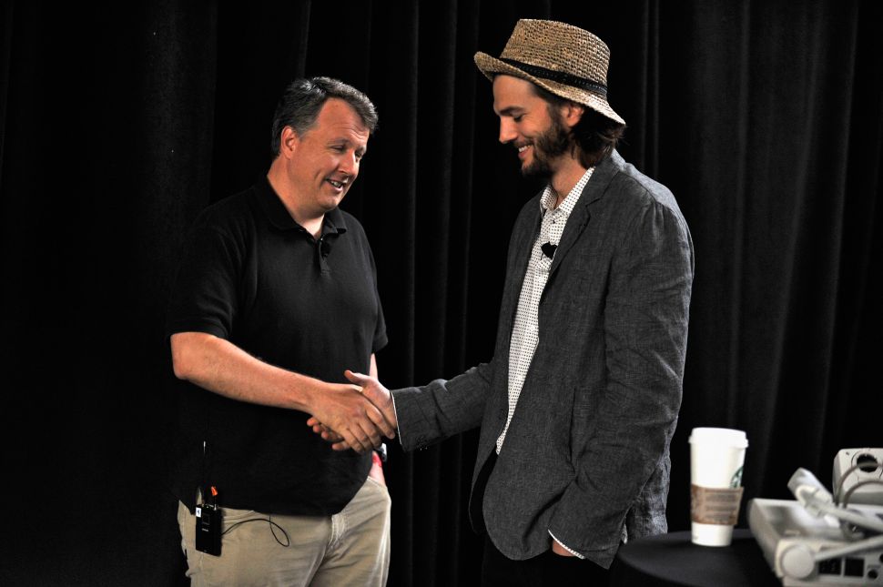 Paul Graham (left) with Ashton Kutcher, at TechCrunch Disrupt. (Photo: Joe Corrigan/Getty)