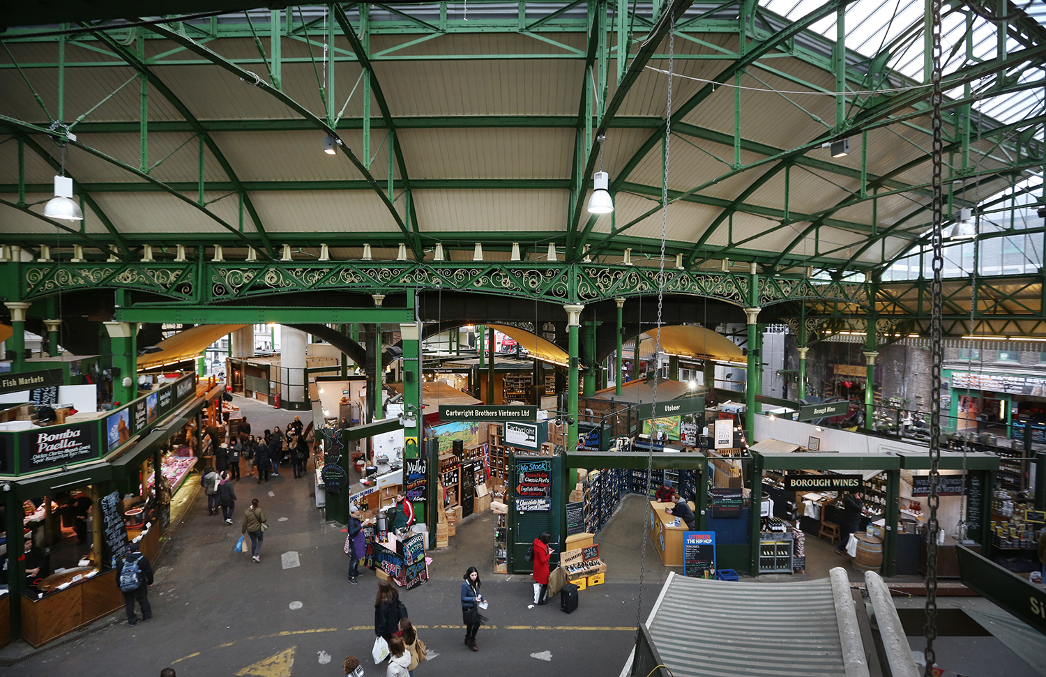 LONDON, ENGLAND - FEBRUARY 07: Shoppers look for bargains at Borough Market on February 7, 2013 in London, England. Borough Market, London's oldest since 1756, has recently completed renovation and today had it's first day of full trading. (Photo by Peter Macdiarmid/Getty Images)