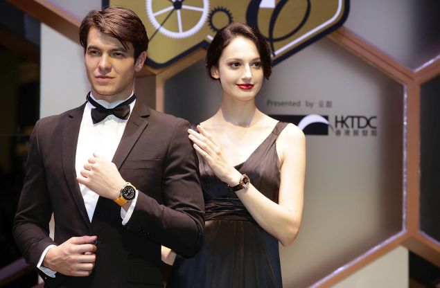 HONG KONG - SEPTEMBER 04: Models displays watches during a watch parade at the Hong Kong Watch And Clock Fair on September 4, 2013 in Hong Kong, Hong Kong.
