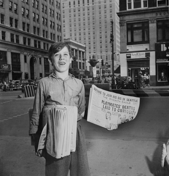 August 1947: Dick Pearce, selling newspapers on the corner of Douglas and Broadway in Wichita, Kansas. (Photo by Fox Photos/Getty Images)