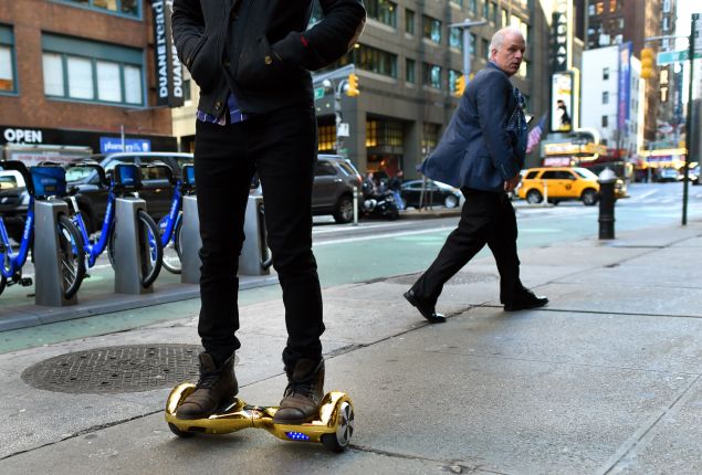 Whizboard Store manager 'Mor Loud' demonstrates the Hoverboard on Broadway in Times Square in New York on December 15, 2015. The hot item on many holiday lists will help you zip around town, the shopping mall and from one end of the workplace to another.These so-called "hoverboards" or self-balancing electric scooters, are surging in popularity in the first season where they have been available at relatively affordable prices -- as low as $300 for some models. AFP PHOTO / TIMOTHY A. CLARY / AFP / TIMOTHY A. CLARY (Photo: Timothy A. Clary/Getty Images)