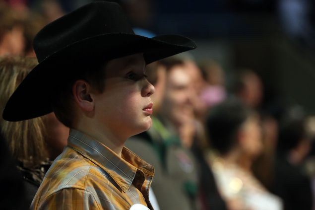 BILOXI, MS - JANUARY 02: A young boy listens as Republican presidential frontrunner Donald Trump speaks at the Mississippi Coast Coliseum on January 2, 2016 in Biloxi, Mississippi. Trump, who has strong support from Southern voters, spoke to thousands in the small Mississippi city on the Gulf of Mexico. Trump continues to split the GOP establishment with his populist and controversial views on immigration, muslims and some of his recent comments on women. (Photo by Spencer Platt/Getty Images)