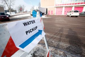 Sign pointing to clean water pick up in Flint, Michigan
