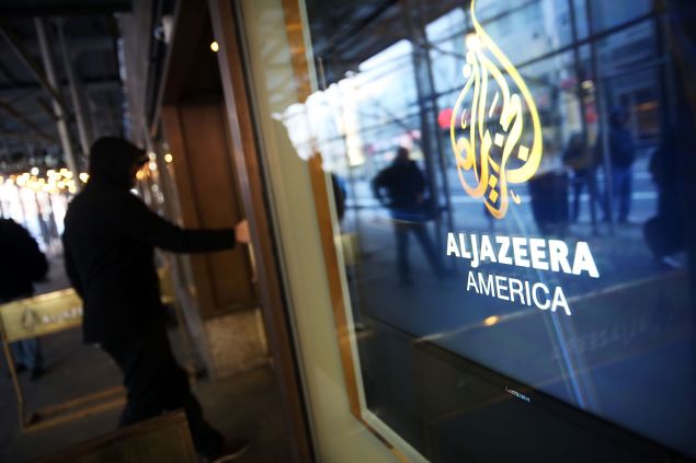 NEW YORK, NY - JANUARY 13: The logo for Al Jazeera America is displayed outside of the cable news channel's offices on January 13, 2016 in New York City. Al Jazeera America, which debuted in August 2013, announced today that they are shutting down. Employees of the struggling news network known as AJAM were informed of the decision during an all-hands staff meeting on Wednesday afternoon. (Photo by Spencer Platt/Getty Images)