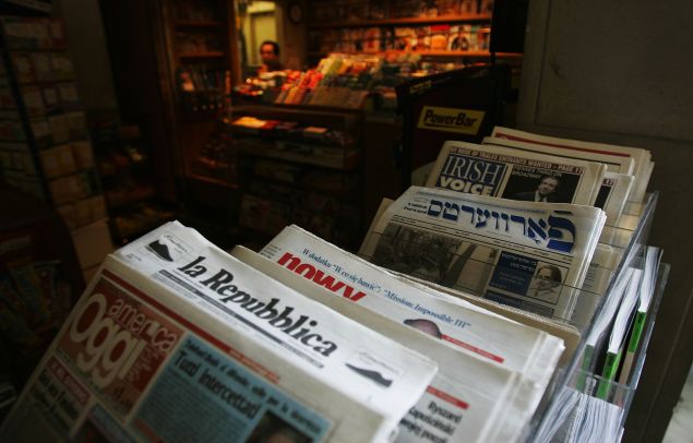 Newspapers in dozens of languages are offered at the newstand of the United Nations. (Photo by Chris Hondros/Getty Images)