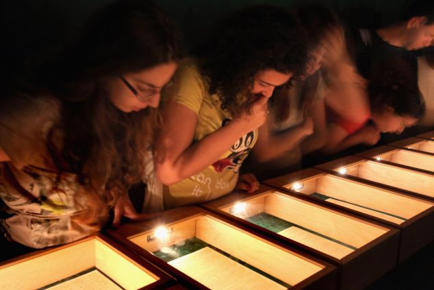 Israeli students inspect Albert Einstein's General Theory of Relativity at the Hebrew University of Jerusalem. (Photo by David Silverman/Getty Images)