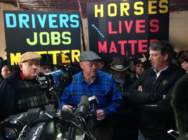 Stable owners Patrick and Cornelius Byrne and driver Ian McKeever protest with workers against the plan to curtail horse carriages (Photo: Will Bredderman for Observer).