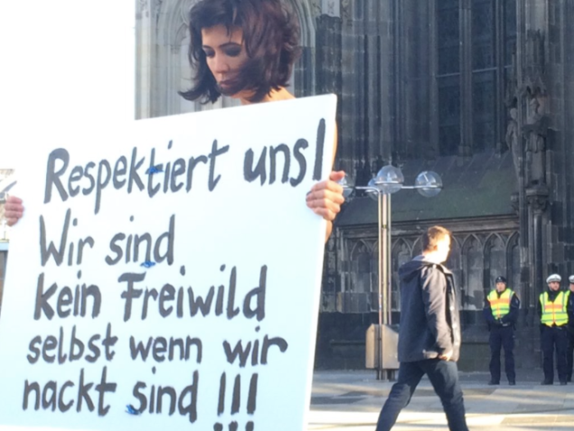 Swiss performance artist Milo Moiré protests violence against women in Cologne. (Photo: Courtesy of Twitter and Bart Biesemans @bart_bies)