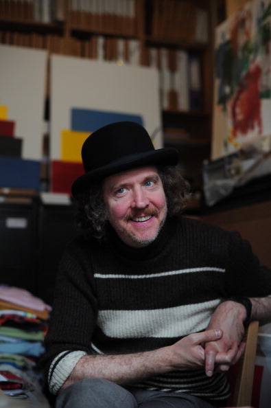 British Turner prize-winning artist Martin Creed poses for a photograph at his east London studio on July 6, 2012. Church bells, bicycle bells, handbells, ship's bells, and even mobile phones will sound across Britain in a "cacophonous, amazing sound" to mark the start of the Olympics, artist Martin Creed told AFP. AFP PHOTO / CARL COURT 