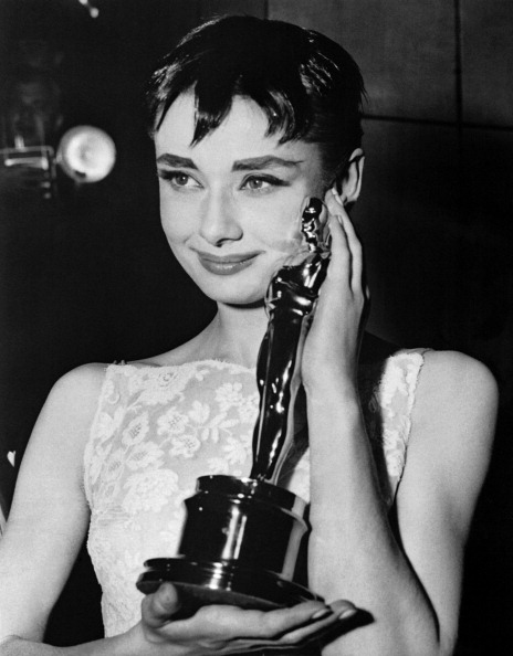 British actress Audrey Hepburn poses with her Oscar for Best Actress for the film "Roman Holiday" on March 25, 1954 during the 26th annual Academy Awards in New York City. AFP PHOTO