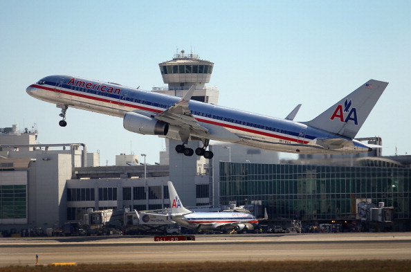 MIAMI, FL - FEBRUARY 07: An American Airlines plane takes off at the Miami International Airport on February 7, 2013 in Miami, Florida. Reports indicate that a deal between American Airlines and US Airways to merge may be set for early next week. If the deal goes through it would create the world's biggest airline.