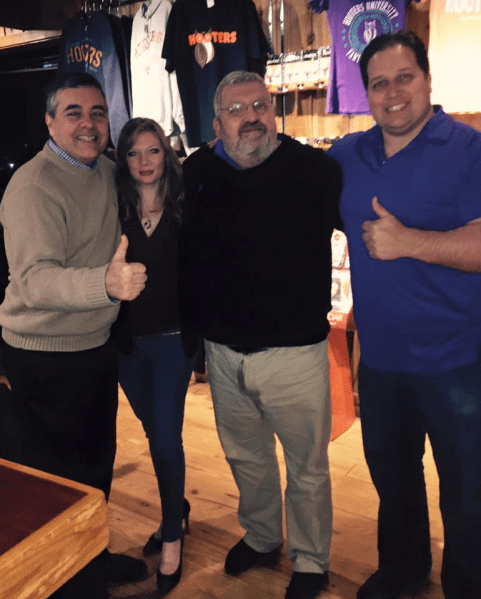 Lobbyist Dana Hudson posted a photo with David Rivera (far left), pollster Dario Moreno and Rafael "Ralph" Perez at an Iowa Hooters while the group campaigned for Mr. Rivera's friend, presidential candidate Marco Rubio. Ms. Hudson is at center-left. 