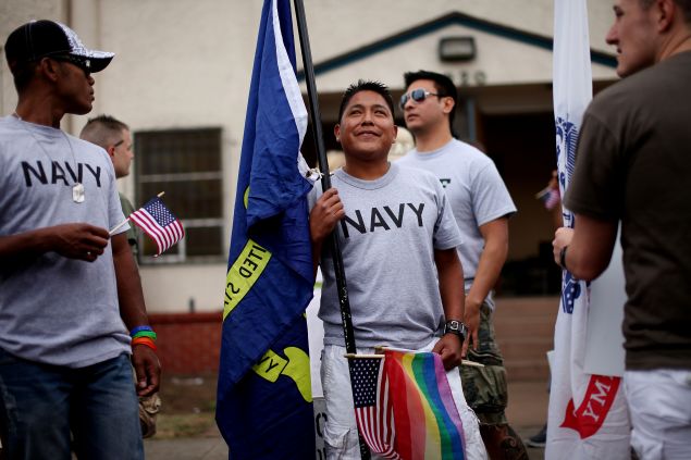 A Navy sailor prepares to march in the July, 2011 San Diego gay pride parade.