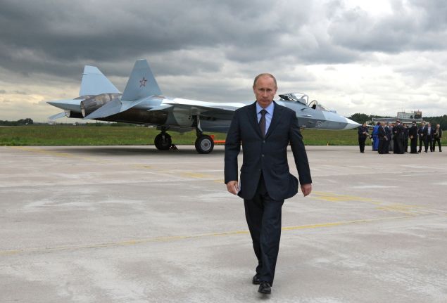 Russian Prime Minister Vladimir Putin walks near a new Russian fighter jet Sukhoi T-50, after its flight in Zhukovksy, outside Moscow on June 17, 2010. AFP PHOTO / RIA NOVOSTI / POOL / ALEXEY DRUZHININ (Photo credit should read ALEXEY DRUZHININ/AFP/Getty Images)