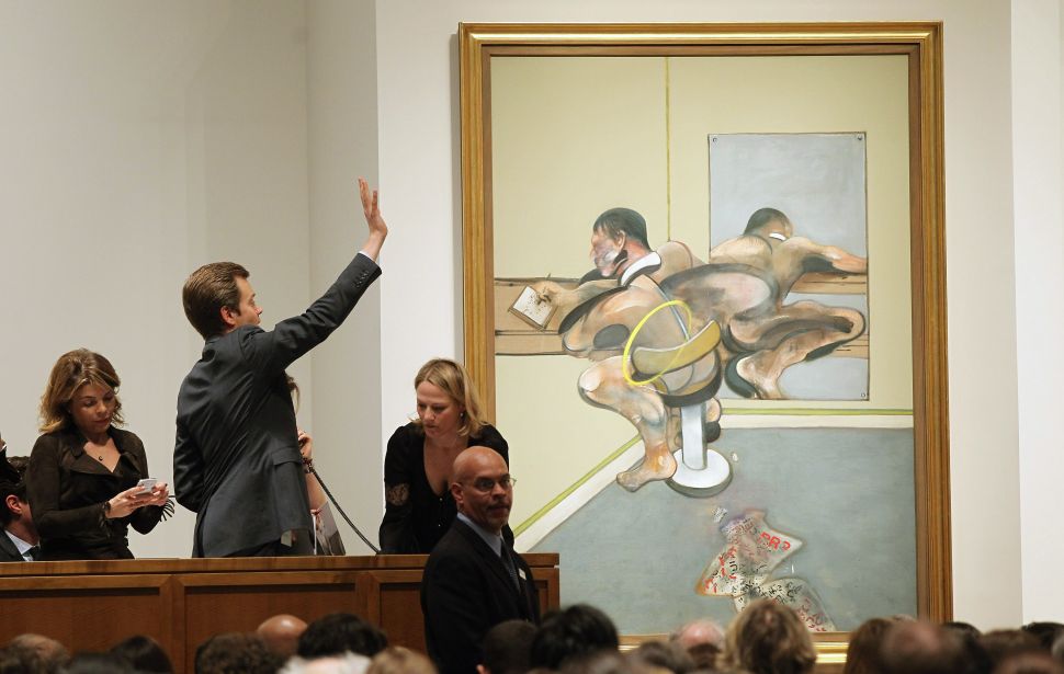 NEW YORK, NY - MAY 09: Francis Bacon's 'Figure Writing Reflected in Mirror" is auctioned at Sotheby's on May 9, 2012 in New York City. The market for contemporary art has been on fire in recent months with Edvard Munch's "The Scream" posting an auction record of $119 million at Sotheby's on May 2. (Photo by Mario Tama/Getty Images)