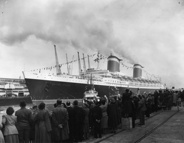 1952: Cheering crowds lining the quayside as the record breaking liner, SS United States arrives in Southampton. She crossed the Atlantic in record time on her maiden voyage. (Photo by M. Fresco/Topical Press Agency/Getty Images)