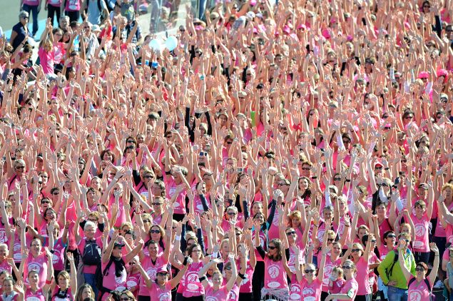 Twelve thousand women wearing a pink t-shirt participate in the "The Young Ladies" race against breast cancer on October 5, 2014 at the Le Mans racetrack, western France. AFP PHOTO / JEAN FRANCOIS MONIER (Photo credit should read JEAN-FRANCOIS MONIER/AFP/Getty Images)