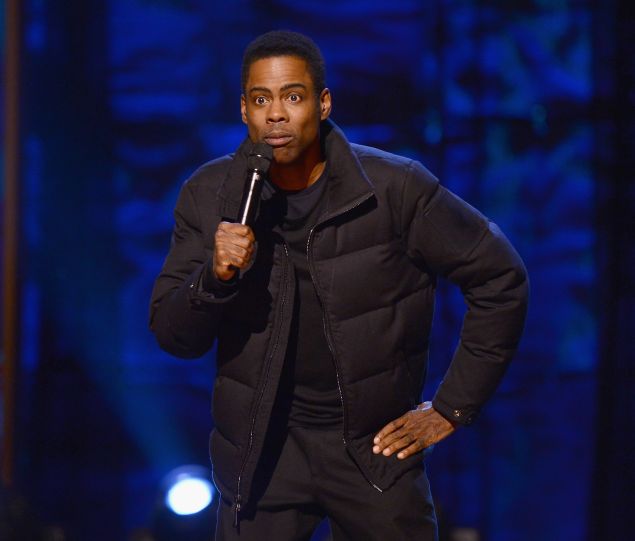 Chris Rock performs on stage at Comedy Central Night Of Too Many Stars at Beacon Theatre on February 28, 2015 in New York City.