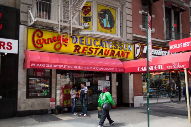 NEW YORK, NY - APRIL 28: People pass the Carnegie Delicatessen in Manhattan after it was shut down over an investigation into tampering with natural gas lines April 28, 2015 in New York City. The landmark deli was closed after Con Ed inspectors discovered evidence that the iconic restaurant had illegally tampered with its gas hookup. (Photo by Kevin Hagen/Getty Images)