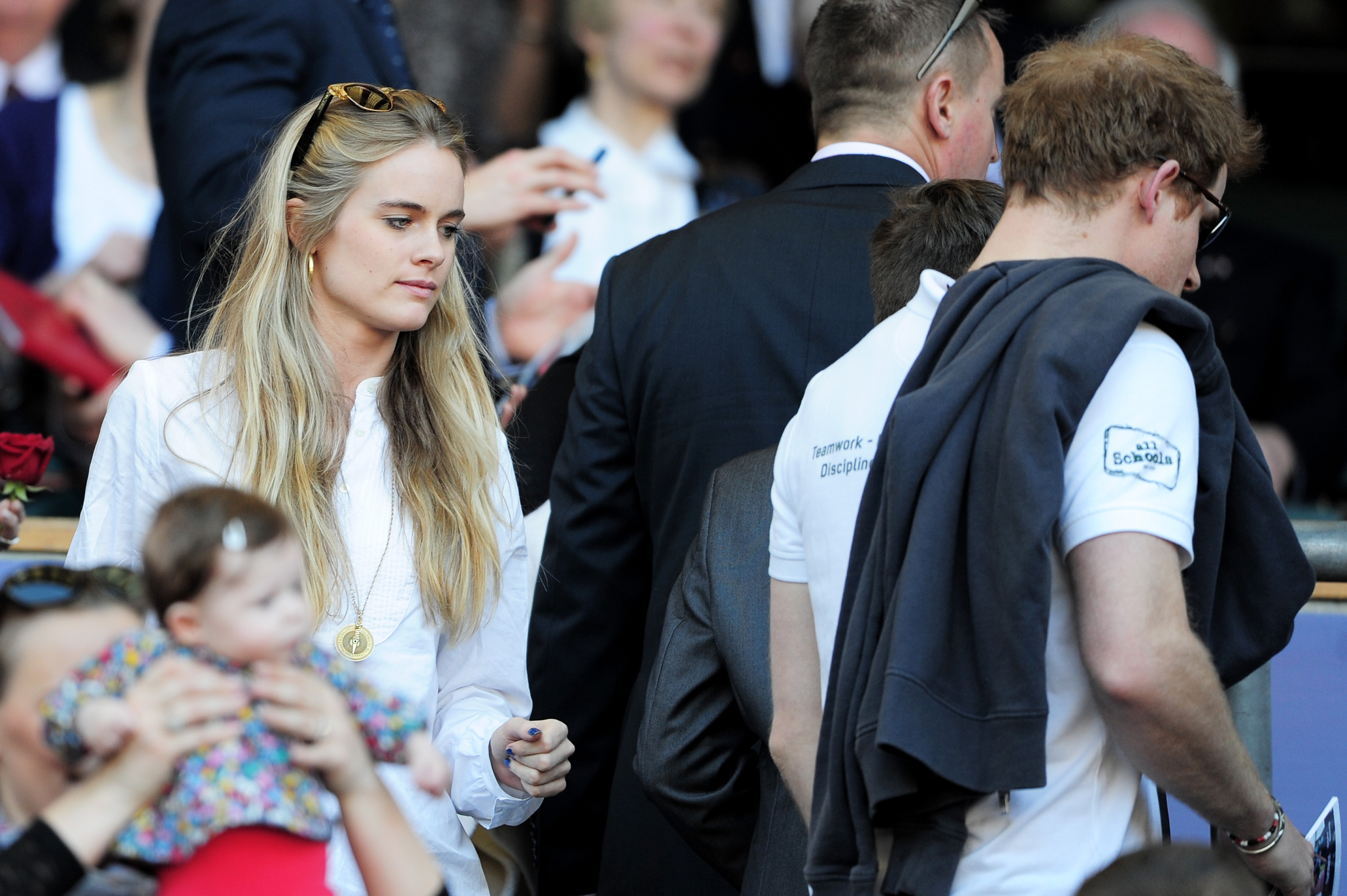 LONDON, ENGLAND - MARCH 09: Prince Harry (R) and Cressida Bonas (L) take their seats during the RBS Six Nations match between England and Wales at Twickenham Stadium on March 9, 2014 in London, England. (Photo by Shaun Botterill/Getty Images)