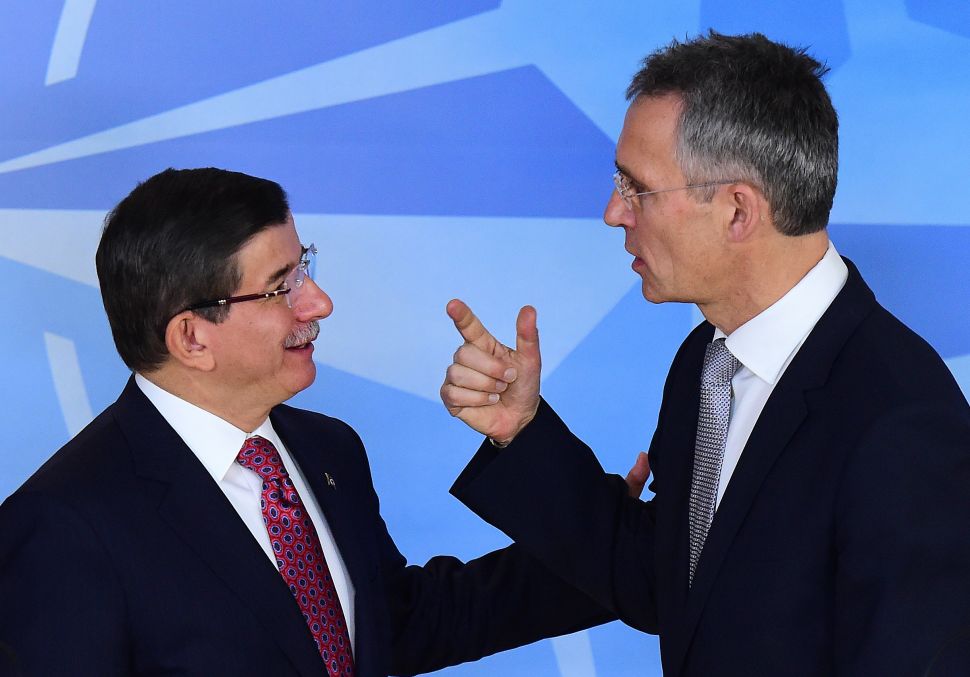 Turkish Prime Minister Ahmet Davutoglu (L) and NATO Secretary General Jens Stoltenberg speak before a press conference at the NATO headquarters on November 30, 2015 in Brussels. (EMMANUEL DUNAND/AFP/Getty Images)