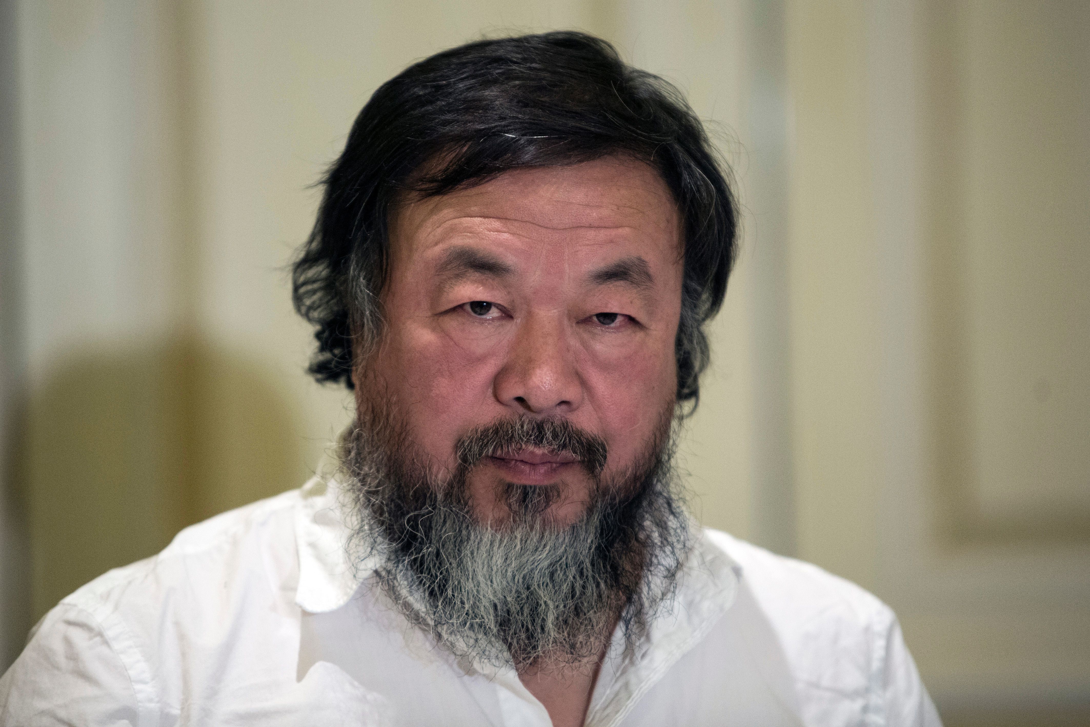 Chinese activist and artist Ai Weiwei is pictured before a press conference in Athens on January 1, 2016. Chinese dissident artist Ai Weiwei paid on December 28, 2015 a holiday visit to refugees and migrants flocking to the Greek island of Lesbos, tweeting out photos and videos in appeals for their plight. / AFP / ANGELOS TZORTZINIS (Photo credit should read ANGELOS TZORTZINIS/AFP/Getty Images)