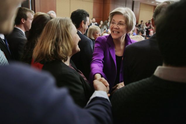 Sen. Elizabeth Warren greets college students before a news conference to unveil a legislative package to address college affordability in the U.S. Capitol Visitors Center College January 21, 2016 in Washington, DC. The Democratic senators hope to "put America on path toward debt-free college education."