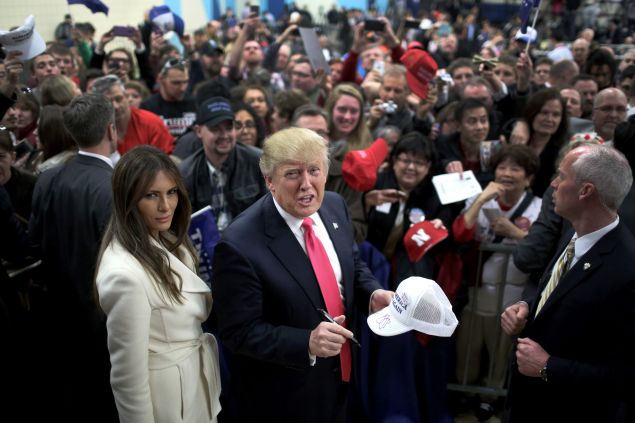 COUNCIL BLUFFS, IA - JANUARY 31: Republican presidential candidate Donald Trump and his wife Melania Trump sign autographs after a campaign rally at the Gerald W. Kirn Middle School on January 31, 2016 in Council Bluffs, Iowa. Trump and other presidential hopefuls are in Iowa trying to gain support and crucial votes for tomorrow's caucuses. (Photo by Christopher Furlong/Getty Images)