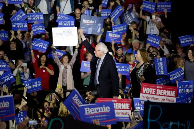 Sen. Bernie Sanders acknowledges the crowd before speaking during his Caucus night event in Des Moines, Iowa. (Photo: Joshua Lott/Getty Images)