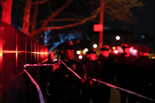 New York Police Officers secure the area near the scene of a shooting in a building on February 4, 2016 in the Bronx in New York City.