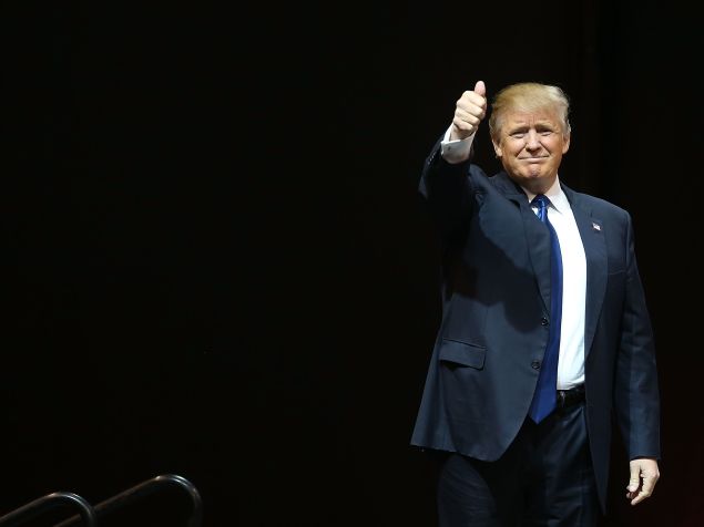 MANCHESTER, NH - FEBRUARY 08: Republican presidential candidate Donald Trump walks on stage as he is introduced during a campaign rally at Verizon Wireless Arena on February 8, 2016 in Manchester, New Hampshire. Democratic and Republican Presidential candidates are finishing up with the last full day of campaigning before voters head to the polls tomorrow. (Photo by Joe Raedle/Getty Images)