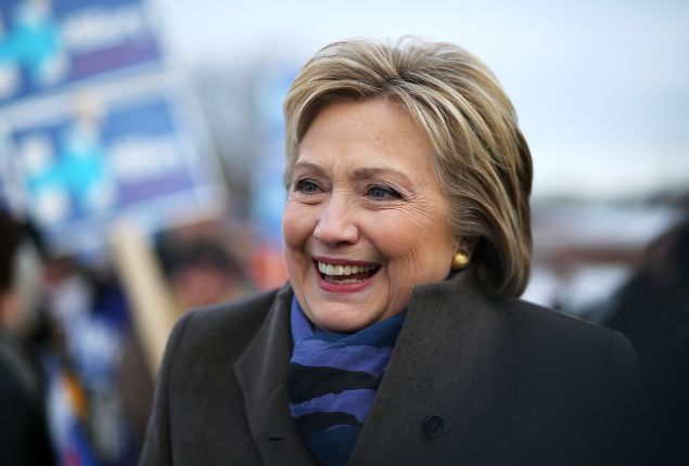 NASHUA, NH - FEBRUARY 09: Democratic presidential candidate former Secretary of State Hillary Clinton greets voters outside of a polling station at Fairgrounds Junior High School on February 9, 2016 in Nashua, New Hampshire. New Hampshire voters are heading to the polls in the nation's first primaries. (Photo by Justin Sullivan/Getty Images)