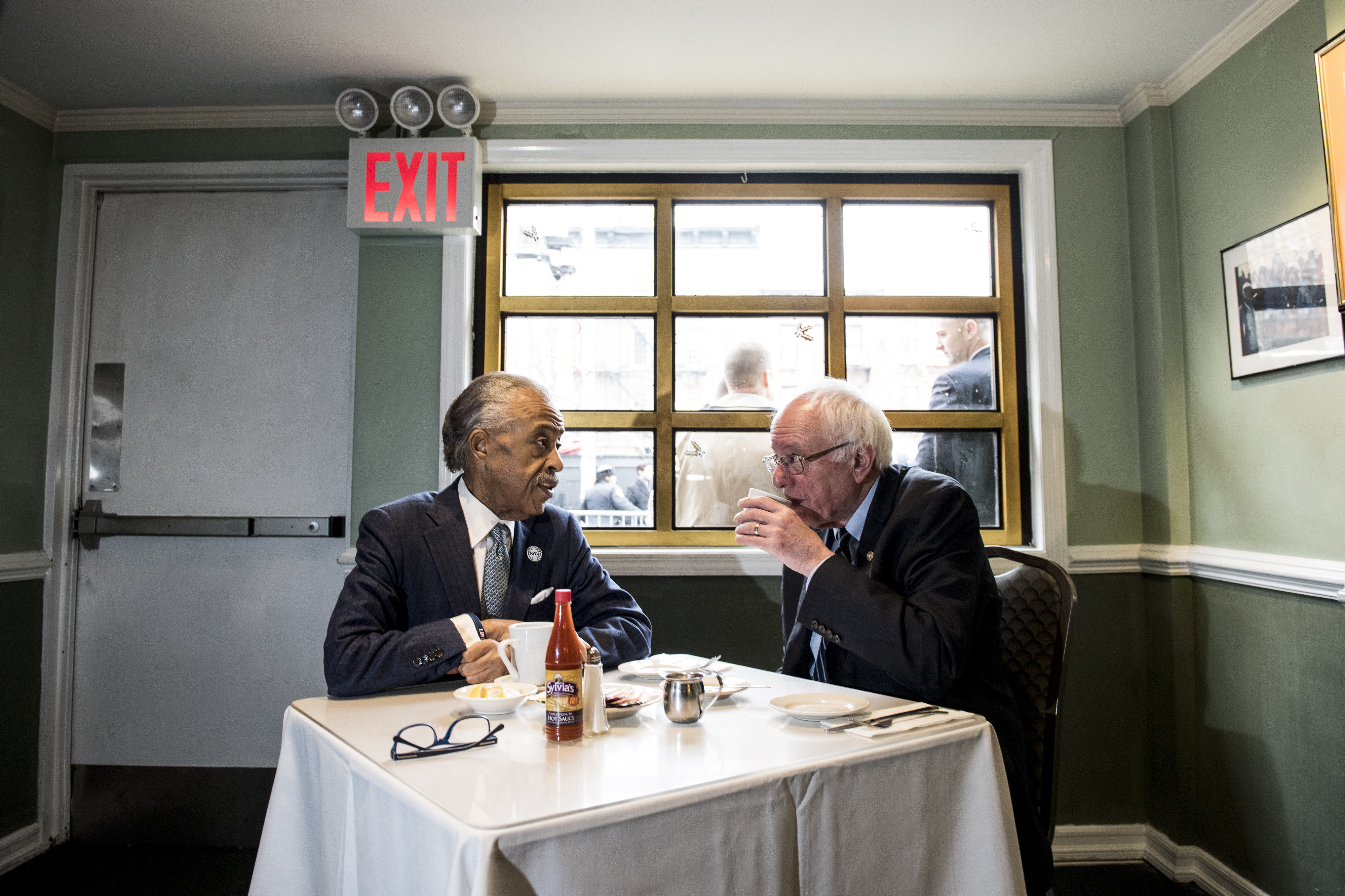 Democratic presidential candidate Sen. Bernie Sanders meets with Reverend Al Sharpton at Sylvia's Restaurant. (Photo by Andrew Renneisen/Getty Images)