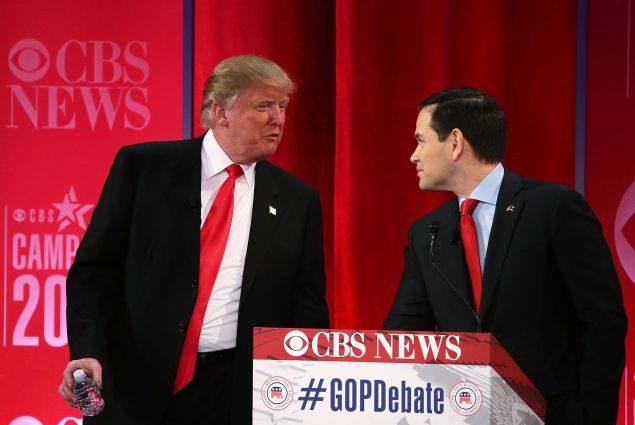 Republican presidential candidates Sen. Marco Rubio listens to Donald Trump during a break of a CBS News GOP Debate February 13 at the Peace Center in Greenville, South Carolina. (Photo: Spencer Platt/Getty Images)